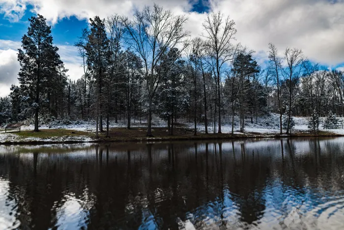 Snow on the banks of a pond at Pharr Mill Park in Harrisburg